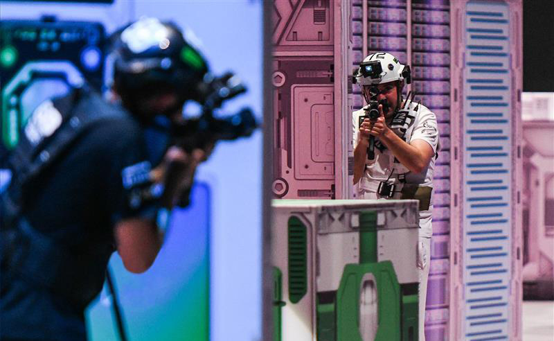 Athletes Competing in the Physical Side of Phygital Shooter