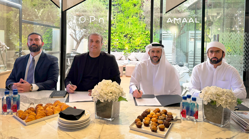 Amaal-and-IOPn-sign-partnership-agreement.-Left-to-right-Jimi-Ibrahim,-COO-of-IOPn,-Mojtaba-Asadian,-CEO-of-IOPn,-Abdulla-Lahej,-Chairman-of-Amaal-and-Erhama-Lahej,-Executive-Director-of-Amaal
