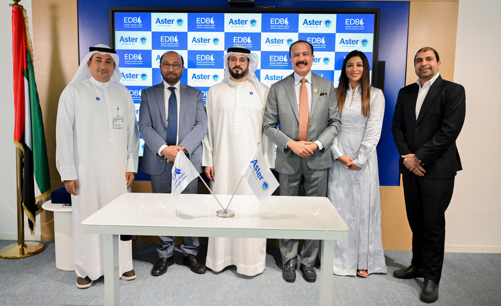 The agreement was signed by Dr. Azad Moopen, Founder Chairman of Aster DM Healthcare and H.E Ahmed Mohamed Al Naqbi, CEO of Emirates Development Bank, in the presence of Alisha Moopen, Iqbal Khan and senior officials from both organisations. (Image Credit: Supplied)